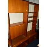 A 1960'S/1970'S G PLAN TEAK TWO SECTION WALL UNIT/BOOKCASE, with various open shelving and cupboards
