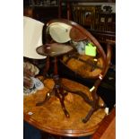 AN EDWARDIAN MAHOGANY OVAL DRESSING MIRROR together with a mahogany wine table (2)
