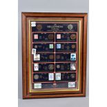 A FRAMED MILLENIUM COLLECTION OF COINS AND STAMPS, to include coins and stamp of Victoria through to