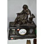 A SLATE MANTLE CLOCK having Roman numerals to the dial, spelter student figure to the top, some