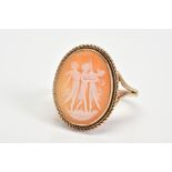 A 9CT GOLD CAMEO RING, of oval design depicting the three graces within a double rope twist surround