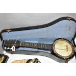 A CASED EIGHT STRING BANJOLIN