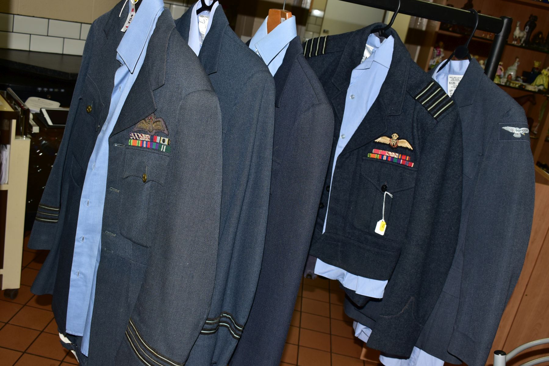 FIVE RAF UNIFORM JACKETS, TROUSERS AND SHIRTS/CAPS, mainly WWII/post WWII era, some with insignia/