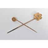 TWO LATE VICTORIAN DIAMOND SET STICKPINS, the first with an old cut diamond in a star setting to the