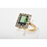 A TOURAMALINE AND DIAMOND CLUSTER RING, designed as a rectangular green tourmaline within a single