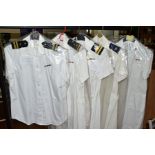 FIVE ITEMS OF WOMENS NAVAL UNIFORMS IN WHITE, one R N blouse, three US Navy shift dresses, one US