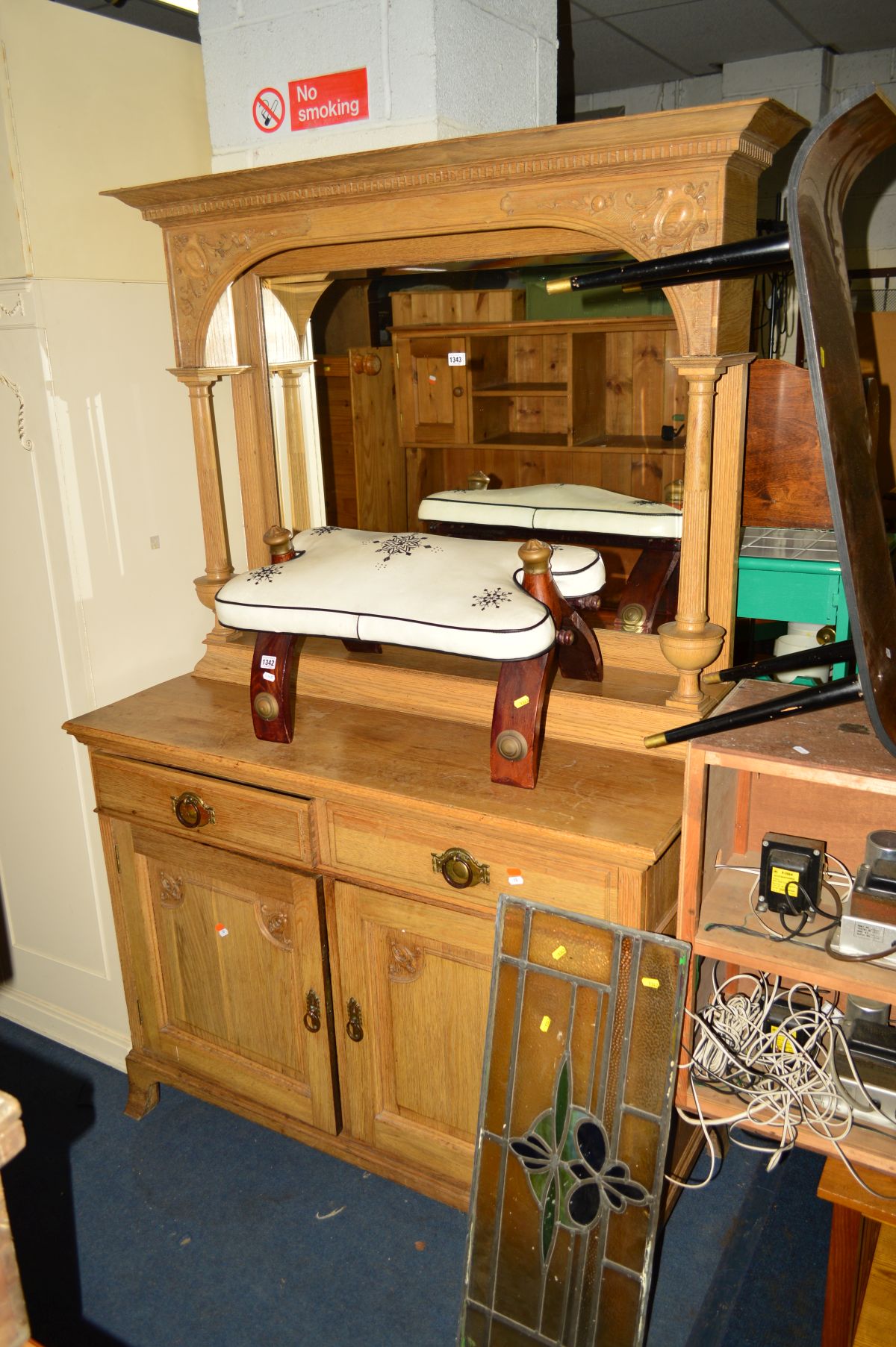 AN EARLY 20TH CENTURY CARVED GOLDEN OAK MIRROR BACK SIDEBOARD, the top cylindrical fluted columns