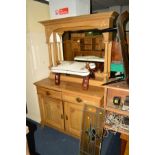 AN EARLY 20TH CENTURY CARVED GOLDEN OAK MIRROR BACK SIDEBOARD, the top cylindrical fluted columns