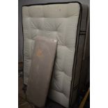 A 4' 6'' DIVAN BED AND MATTRESS together with a headboard