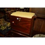 AN EDWARDIAN MAHOGANY PIANO STOOL with a fall front cupboard