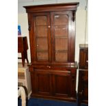 A VICTORIAN MAHOGANY GLAZED DOUBLE DOOR BOOKCASE above a single drawer and cupboard, width 106cm x