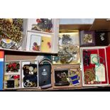 A BOX OF COSTUME JEWELLERY, to include earrings, necklaces, brooches, Rotary badges etc and a