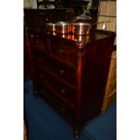 A LATE VICTORIAN MAHOGANY CHEST OF TWO SHORT AND THREE LONG GRADUATING DRAWERS, flanked by