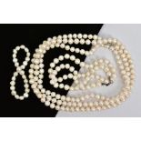 TWO CULTURED PEARL NECKLACES AND A SULTURED PEARL BRACELET, to include a long necklace, a further