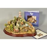 A LARGE LIMITED EDITION LILLIPUT LANE SCULPTURE, 'Out of the Storm' No2369/3000, on wooden plinth,
