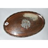 A HUGH WALLIS ARTS AND CRAFTS TRAY, oval in shape with pewter floral motif set into copper,