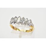 A DIAMOND RING, designed with six marquise cut diamonds in collet mounts to the plain polsihed band,