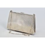 A GEORGE V SILVER PURSE IN THE FORM OF A HANDBAG, engine turned vertical stripes, vacant