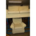 A CREAM UPHOLSTERED TWO SEATER SETTEE with matching armchair (2)