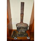 A VINTAGE CAST IRON COAL BURNING STOVE, with two hobs