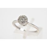 A DIAMOND CLUSTER RING, designed as a circular cluster of single cut diamonds, ring size L,