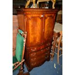 A REPRODUCTION MAHOGANY SERPENTINE TWO DOOR CABINET, width 78cm x depth 47cm x height 146cm (key)