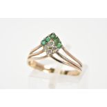 A 9CT GOLD RING, the v-shape ring set with circular cut emeralds and cubic zirconia to the