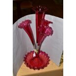 A RUBY COLOURED GLASS EPERGNE, with wavy edged bowl rising to a central flute flanked by three lower