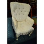 A MODERN FLORAL WHITE AND BUTTONED UPHOLSTERED ARMCHAIR together with an Edwardian mahogany