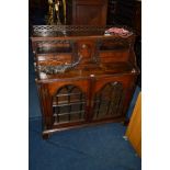 A 19TH CENTURY AND LATER OAK GLAZED TWO DOOR CABINET in the form of an open bureau, with a