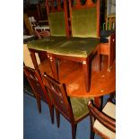 A MID 20TH CENTURY OVAL EXTENDING DINING TABLE, and four chairs (5)