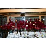 A COLLECTION OF CRANBERRY GLASS to include decanters, large water jug and glasses, vases, port