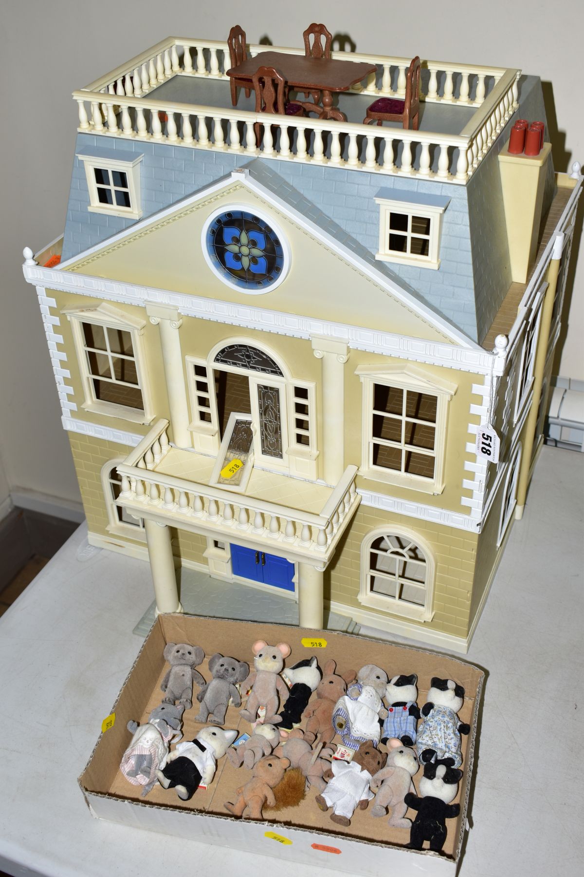 A SYLVANIAN FAMILIES GRAND HOTEL, missing plant pots and most furniture, has slight damage to one