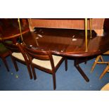 A MID 20TH CENTURY DYRLUND ROSEWOOD EFFECT EXTENDING DINING TABLE, with two additional leaves and