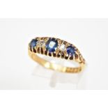 AN EARLY 20TH CENTURY SAPPHIRE AND DIAMOND GRADUATED HALF HOOP RING, hallmarked 18ct gold, London