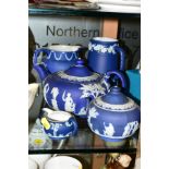 WEDGWOOD BLUE JASPERWARES, to include teapot, covered sugar bowl, small cream jug and two jugs,