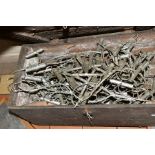 A WOODEN CRATE OF DECORATIVE SPRAYED SILVER METAL FLOWER ARRANGING STANDS