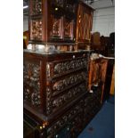 A MID TO LATE 20TH CENTURY HEAVILY CARVED OAK SIDEBOARD/CHEST OF SIX DRAWERS, with foliage and