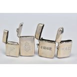 FOUR VICTORIAN, EDWARDIAN AND GEORGE V SILVER VESTA CASES, all of rectangular form and engraved with