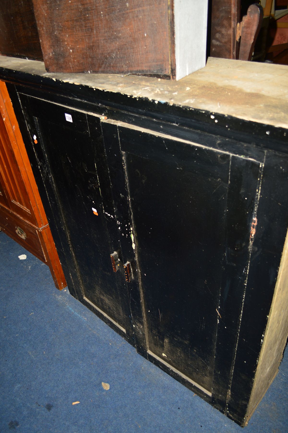 A VICTORIAN BLACK PAINTED PINE TWO DOOR CUPBOARD, width 120cm x depth 37cm x height 125cm (later