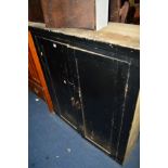 A VICTORIAN BLACK PAINTED PINE TWO DOOR CUPBOARD, width 120cm x depth 37cm x height 125cm (later