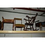 AN EARLY 20TH CENTURY MAHOGANY ROCKING CHAIR with a carved grotesque face splat back, together