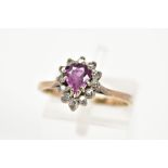 A 9CT GOLD RUBY AND DIAMOND RING, designed with a tiered pear cut ruby and single cut diamond