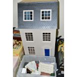 A MODERN WOODEN DOLLS HOUSE, modelled as a three storey Georgian town house, kit built and