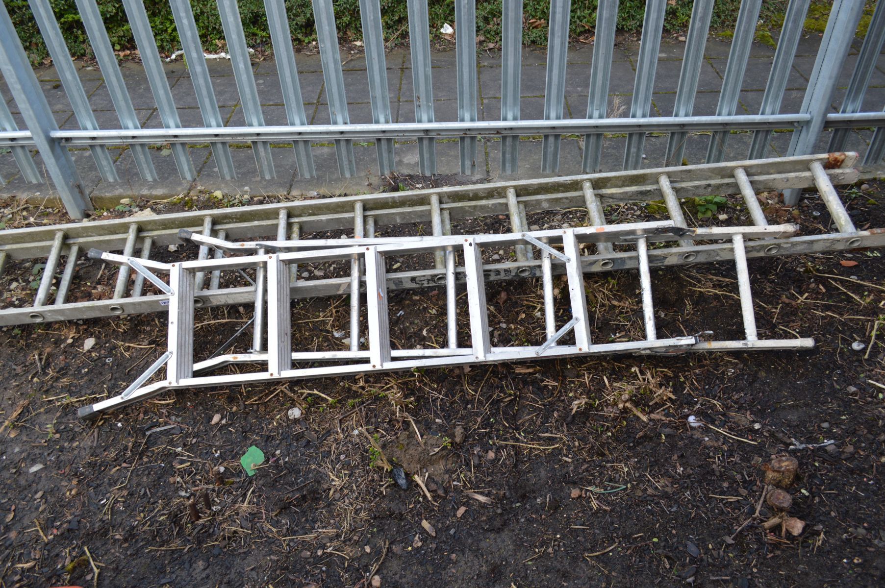 AN ALUMINIUM EXTENSION LADDER and a step ladder (2)