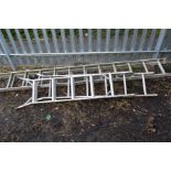 AN ALUMINIUM EXTENSION LADDER and a step ladder (2)