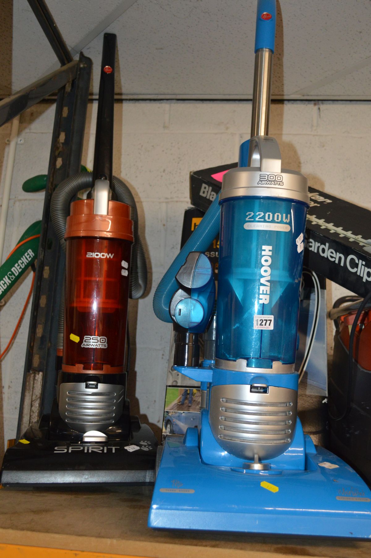 A HOOVER 2200W UPRIGHT VACUUM CLEANER together with a Hoover 2100W upright vacuum cleaner (2)