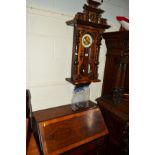 A LATE VICTORIAN VIENNA WALL CLOCK, together with a walnut fall front bureau with three drawers (