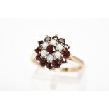 AN OPAL AND GARNET TIERED CLUSTER RING, stamped 9ct, ring size N1./2, approximate weight 4 grams