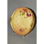 A ROYAL WORCESTER BLUSH IVORY TWIN HANDLED BOWL, moulded as basket weave with floral decoration,